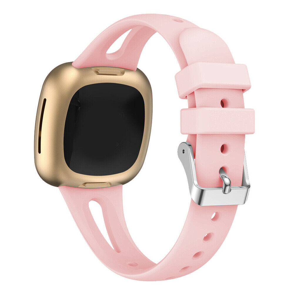 Eine rosa Smartwatch mit goldener Lünette und schwarzem Bildschirm. Das Armband ist rosa mit silberner Schnalle.
