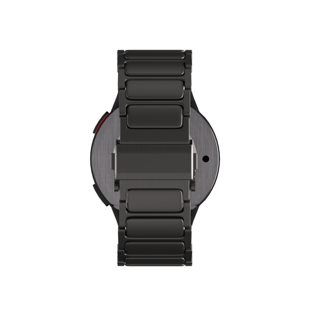 Eine schwarze Smartwatch mit Metallarmband vor schwarzem Hintergrund. Das Zifferblatt ist grau mit rotem Akzent.
