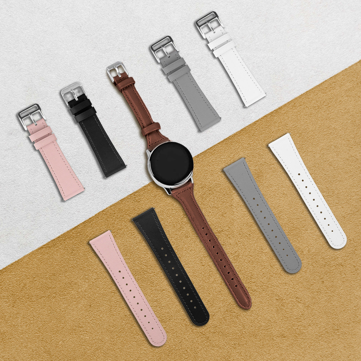 Eine Smartwatch mit braunem Lederarmband, umgeben von verschiedenfarbigen Armbändern: rosa, schwarz, grau und weiß, auf einer strukturierten Oberfläche.