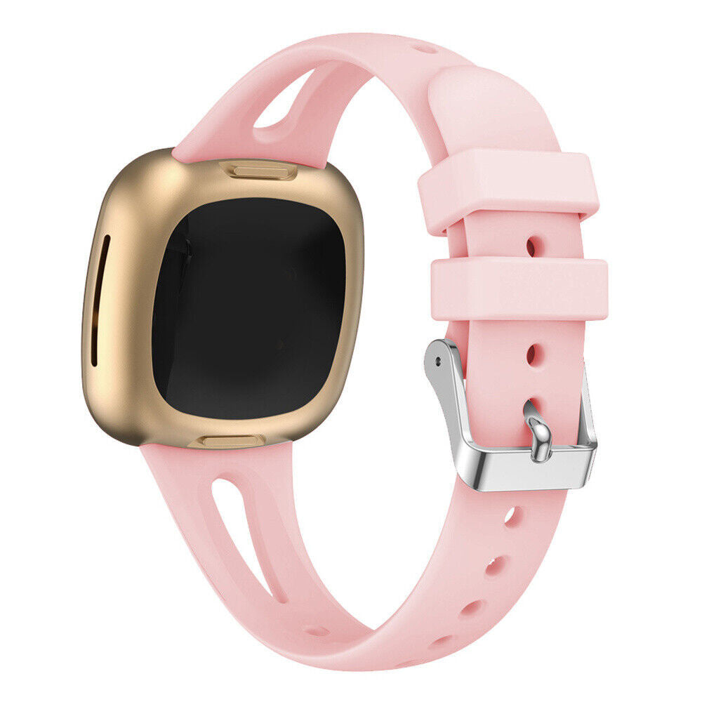 Eine rosa Smartwatch mit goldenem Rahmen und schwarzem Bildschirm, mit einem rosa Armband und silberner Schnalle.
