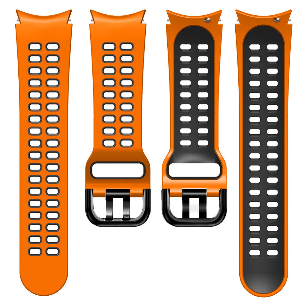 Vier orange-schwarze Uhrenarmbänder. Zwei sind ganz orange mit Löchern, zwei sind orange mit schwarzen Zentren und Löchern. Schwarze Schnallen.