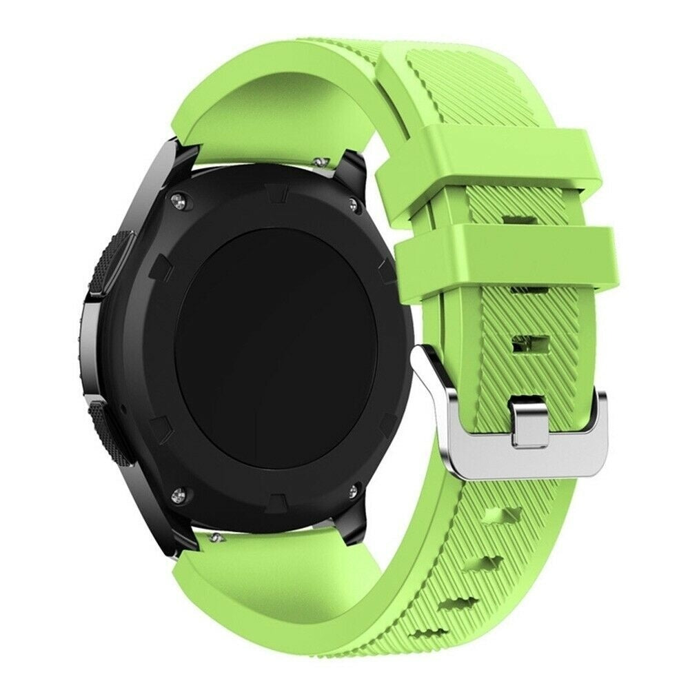 Eine Smartwatch mit schwarzem, kreisförmigem Zifferblatt und hellgrünem Armband. Das Armband ist geschnallt und zeigt strukturierte Details.