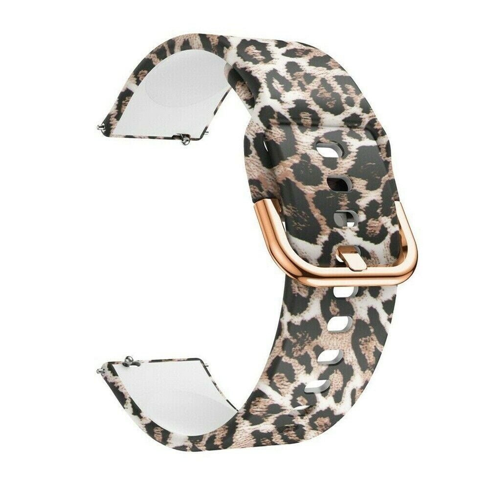 Ein Armband mit Leopardenmuster und einer goldenen Schnalle. Das Armband ist gebogen, mit weißen Unterseiten an jedem Ende.