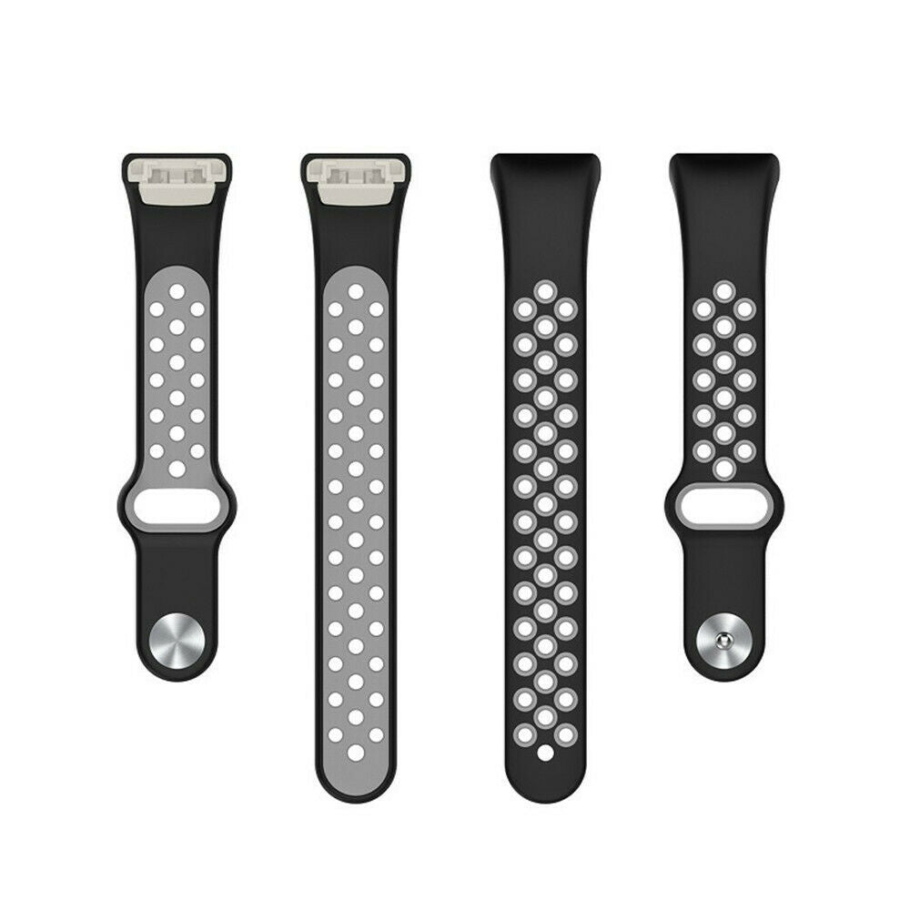Vier schwarze Uhrenarmbänder mit unterschiedlichen Designs. Zwei haben eine graue Innenseite mit runden Löchern, zwei sind schwarz mit ähnlichen Löchern.