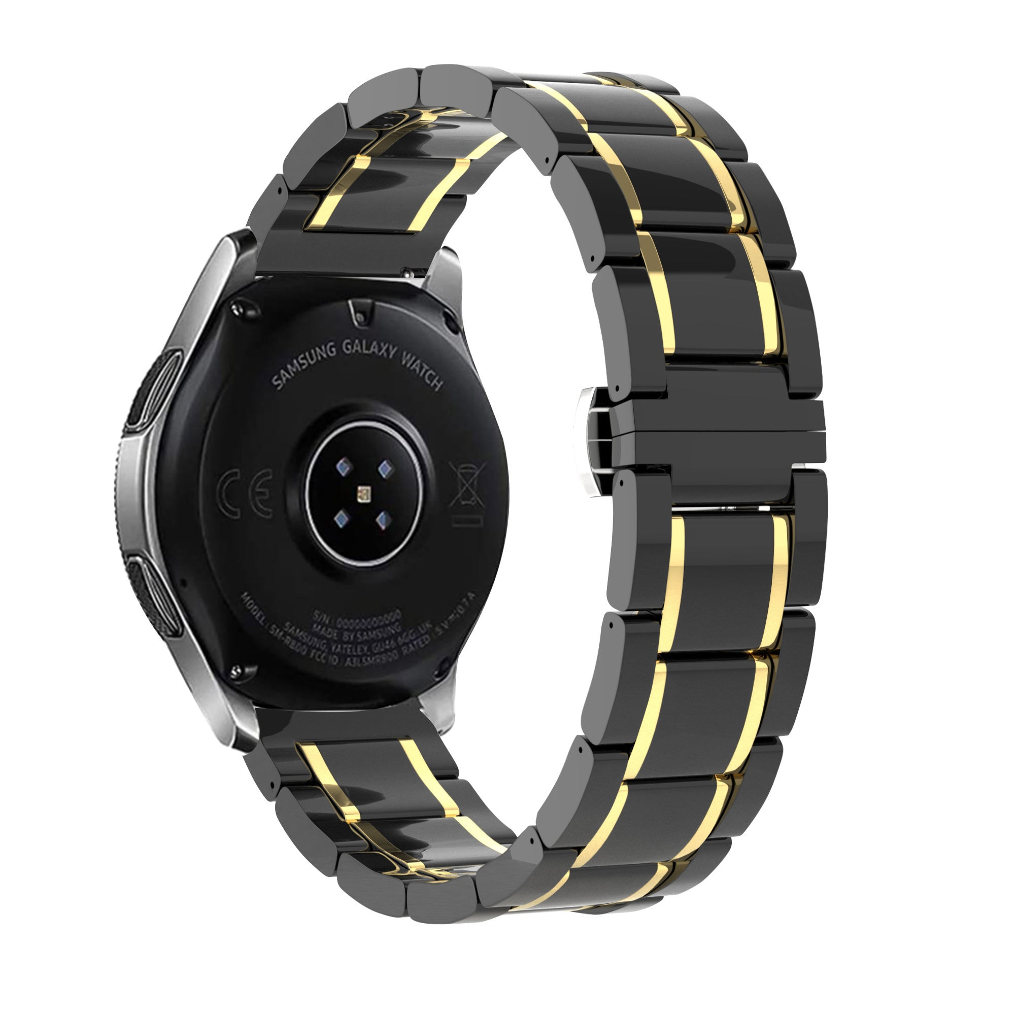 Eine Samsung Galaxy Watch mit einem schwarz-goldenen Armband wird vor weißem Hintergrund gezeigt. Die Rückseite der Uhr ist sichtbar.