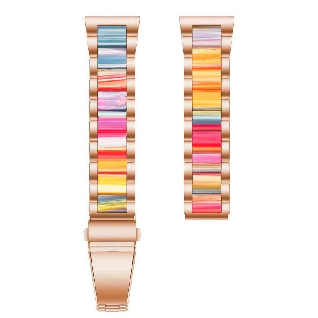 Roségoldene Uhrenarmbänder mit bunten, vertikalen Streifen. Ein Armband ist komplett, das andere ist abgenommen.