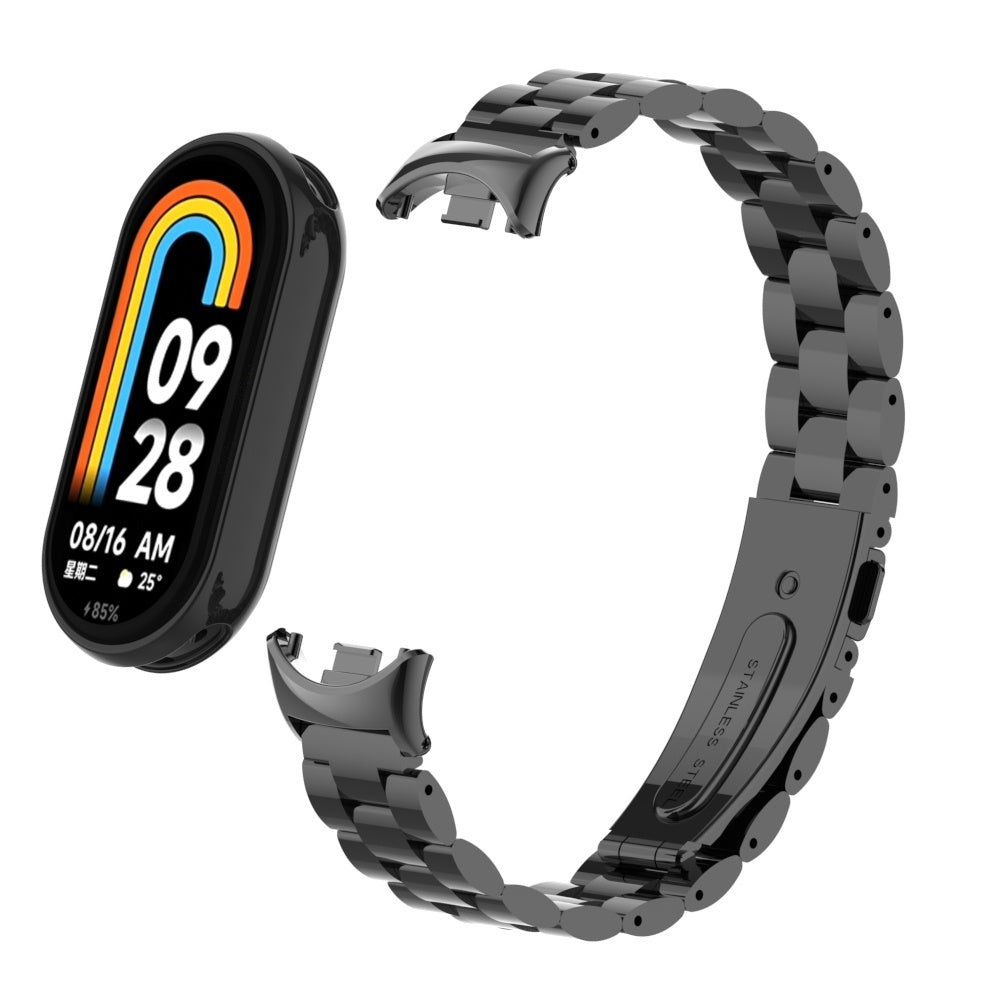 Eine schwarze Smartwatch mit separatem schwarzen Metallarmband. Das Zifferblatt zeigt Zeit, Datum und Akkustand an.