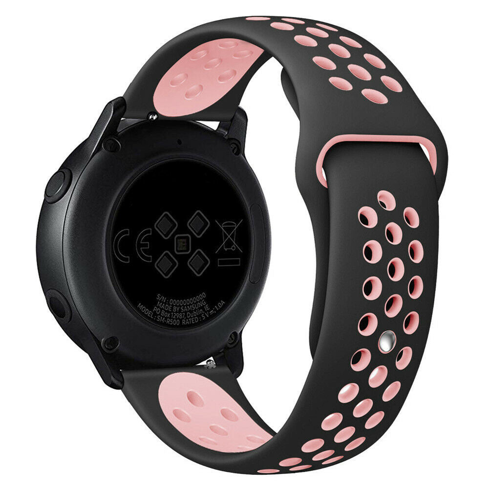 Schwarze Smartwatch mit schwarzem und rosa Armband. Die Uhr ist rund und das Armband hat Löcher. Rückseite der Uhr hat Text.