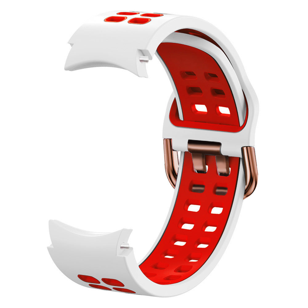 Weiß-rotes Uhrenarmband. Das Armband hat ein gebogenes Design mit roter Innenseite und weißer Außenseite. Es hat kupferfarbene Verschlüsse.