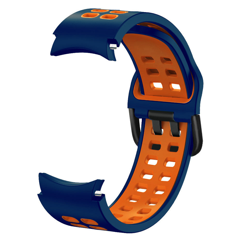 Ein blau-oranges Uhrenarmband. Die Innenseite ist orange mit quadratischen Löchern. Die Außenseite ist blau.