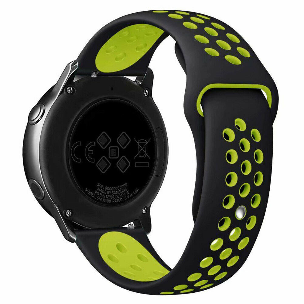 Schwarze Smartwatch mit grünen Akzenten. Die Uhr hat ein schwarzes Armband mit grünen Löchern. Die Rückseite zeigt technische Details.