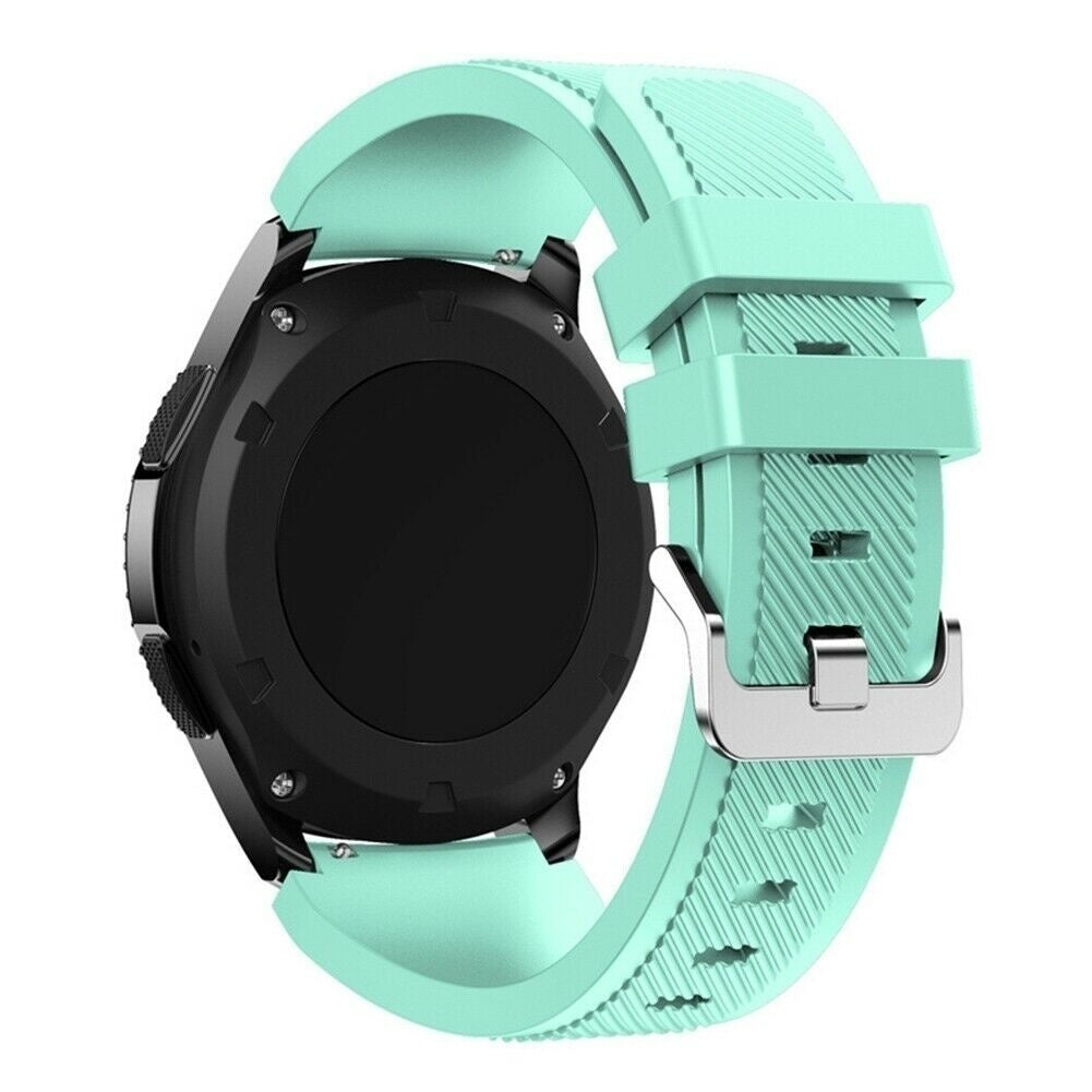 Eine schwarze Smartwatch mit mintgrünem Armband, Schnalle und Gehäuse, vor weißem Hintergrund. Die Uhr ist von hinten zu sehen.