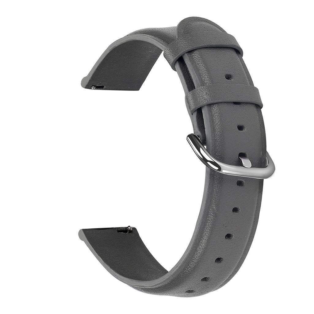 Ein graues Uhrenarmband mit silberner Schnalle wird vor weißem Hintergrund gezeigt. Das Armband ist gebogen und zeigt seine Form und Details.