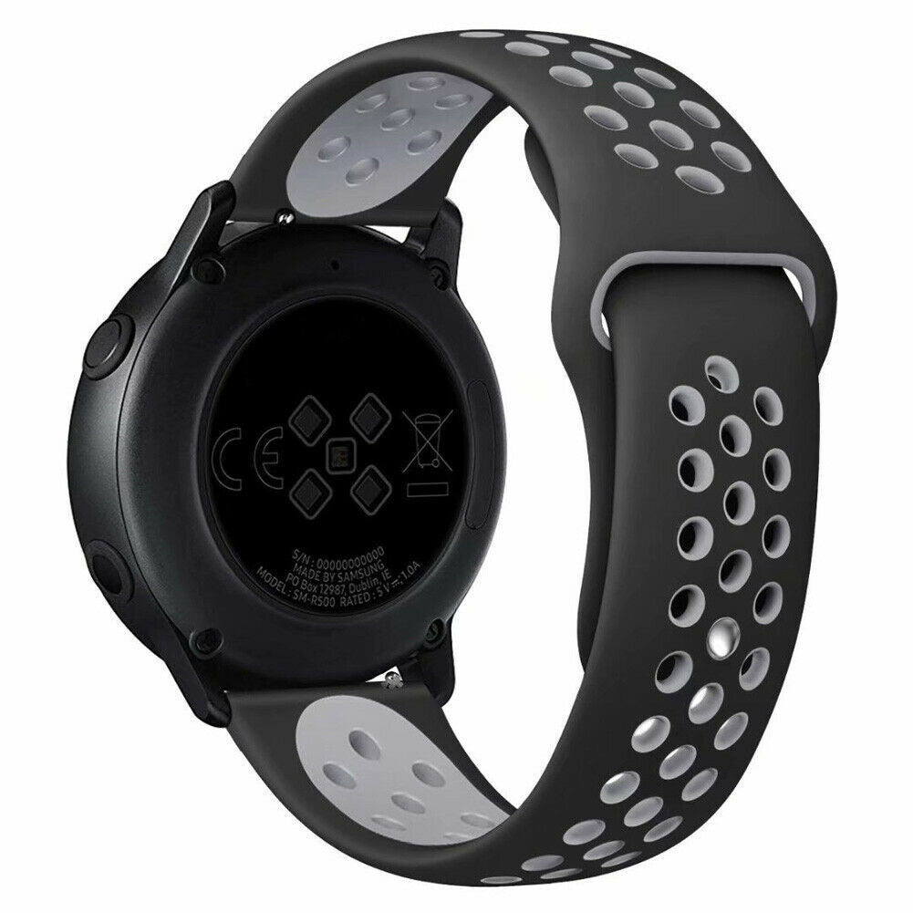 Schwarze Smartwatch mit schwarzem Armband mit weißem Innenfutter und Löchern. Die Rückseite der Uhr ist sichtbar und zeigt Details.