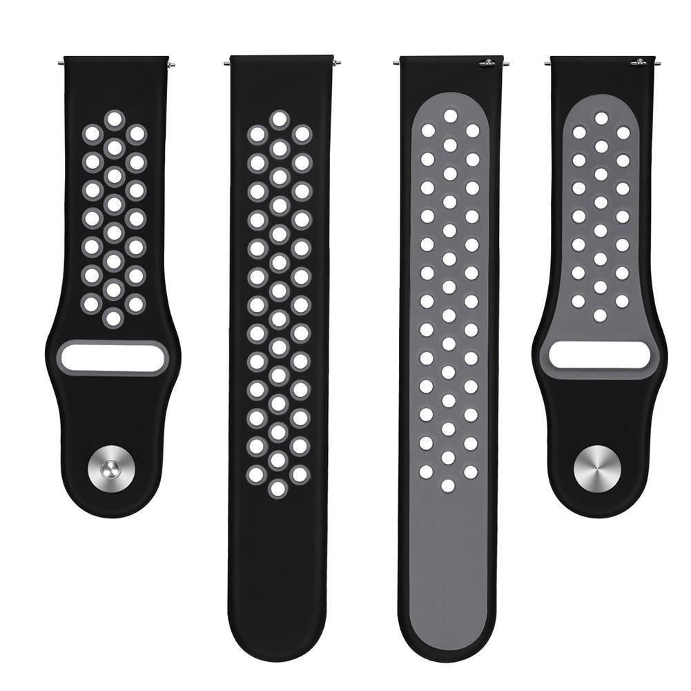 Vier schwarze Uhrenarmbänder mit weißen perforierten Löchern. Zwei sind tiefschwarz, eins grau und eins schwarz mit grauem Innenraum.