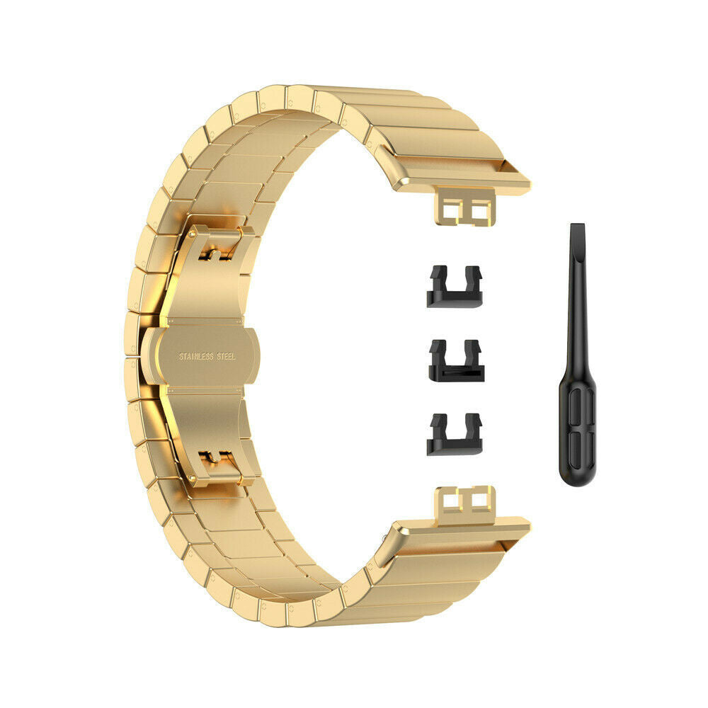 Ein goldenes Edelstahl-Uhrenarmband mit einem schwarzen Schraubendreher und drei schwarzen Verschlusskomponenten auf weißem Hintergrund.