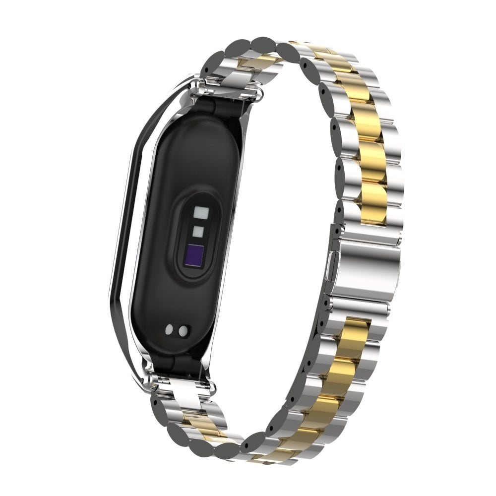 Ein Armband für eine Smartwatch mit schwarzem Zifferblatt und einem zweifarbigen Metallarmband mit silbernen und goldenen Gliedern.