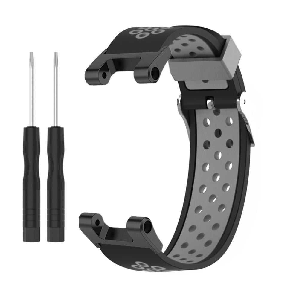 Schwarzes und graues Uhrenarmband mit zwei kleinen Schraubendrehern. Armband hat Perforationen und einen Verschluss. Werkzeuge sind auf der linken Seite.