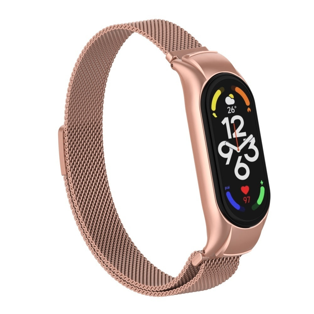 Roségoldene Smartwatch mit Mesh-Armband. Der Bildschirm zeigt Uhrzeit, Temperatur und Gesundheitsdaten. Die Uhr ist auf weißem Hintergrund.