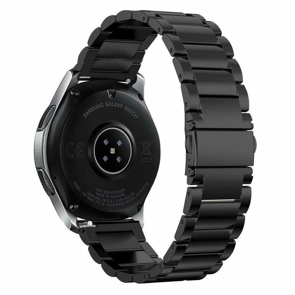 Eine schwarze Samsung Galaxy Watch mit schwarzem Metallband, die Rückseite ist sichtbar. Die Uhr befindet sich auf weißem Hintergrund.