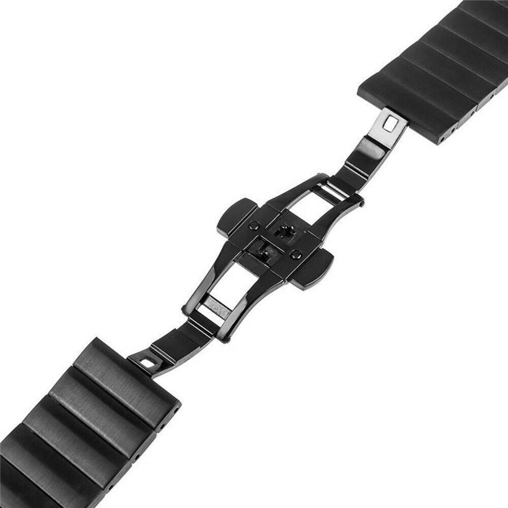 Ein schwarzes Uhrenarmband, abgenommen, liegt auf einer weißen Oberfläche. Der Verschluss ist geöffnet und zeigt den Mechanismus.