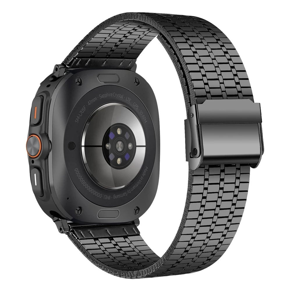 Schwarze Smartwatch mit Metallarmband, zeigt die Rückseite mit Sensoren und Textdetails. Die Uhr liegt auf einer weißen Oberfläche.