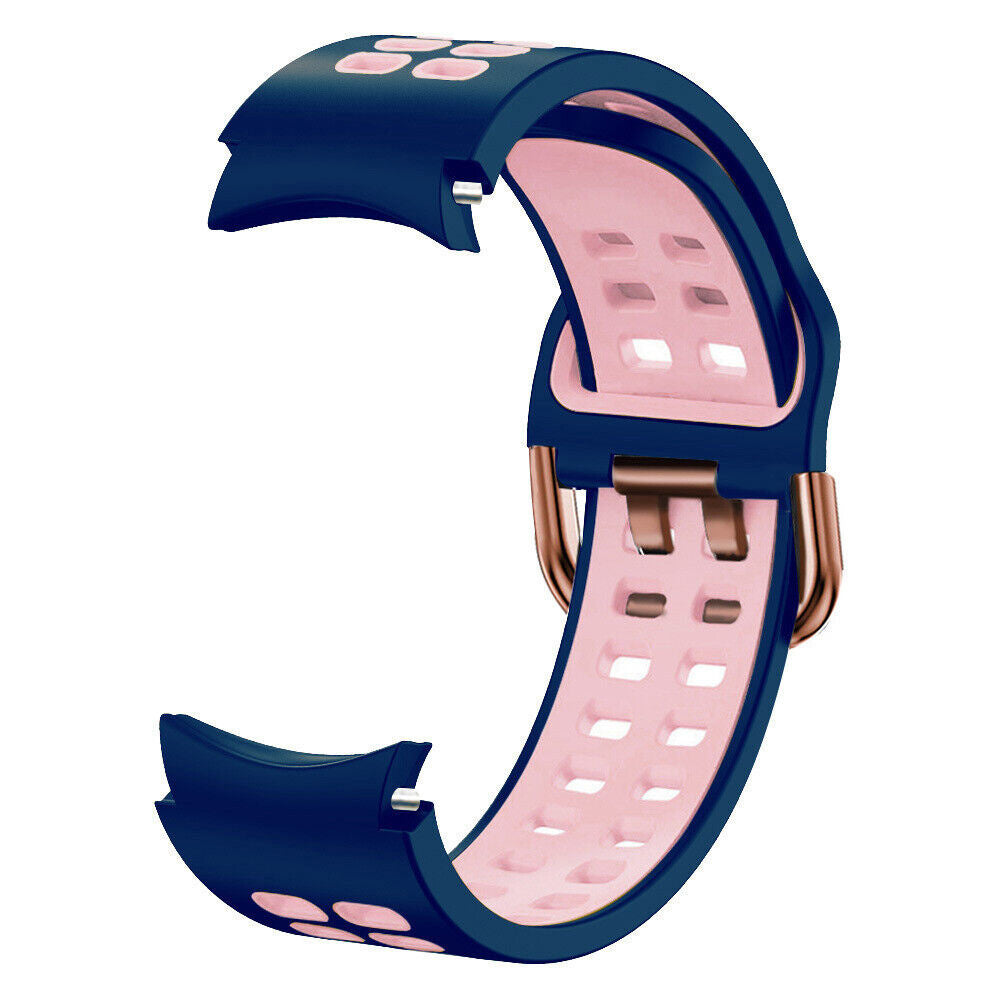 Ein marineblaues und rosa Uhrenarmband. Es hat eine roségoldene Schnalle. Das Armband besteht aus Silikon. Der rosa Teil hat Löcher.