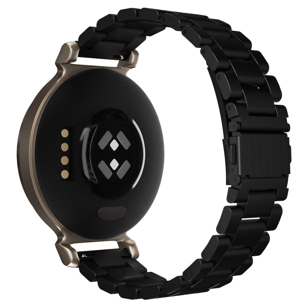 Schwarze Smartwatch mit goldfarbenem Rahmen und schwarzem Metallband. Die Rückseite zeigt Sensoren und Ladekontakte.