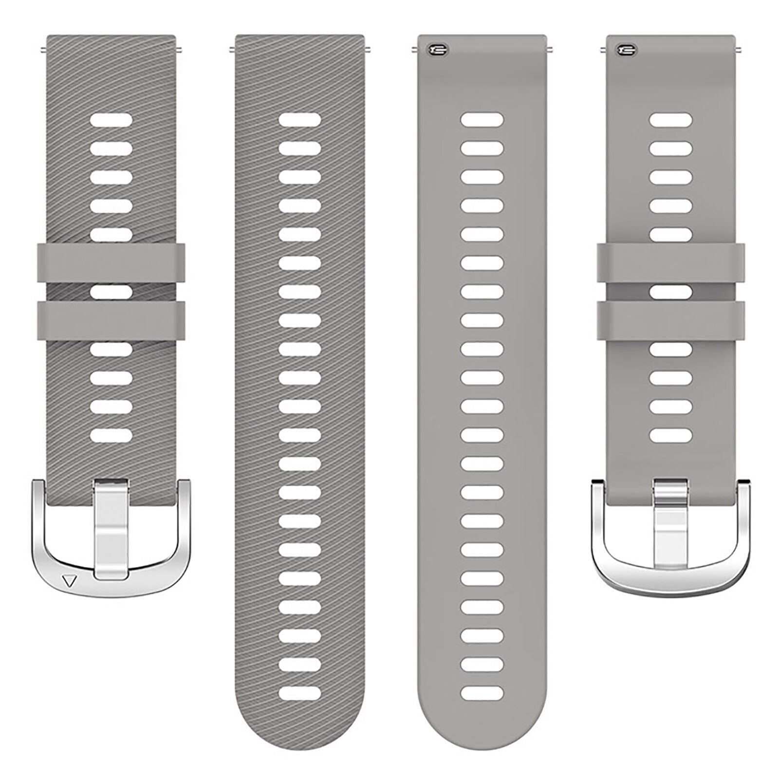 Vier graue Uhrenarmbänder mit silbernen Schnallen. Jedes Armband hat ovale Löcher. Zwei Armbänder sind nebeneinander, zwei rechts.