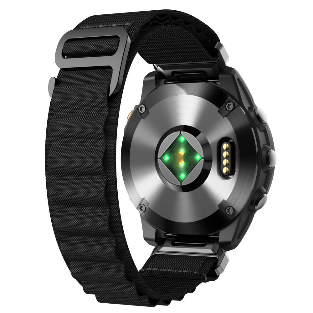 Schwarze Smartwatch-Rückseite mit Herzfrequenzsensor, Ladepins und schwarzem Armband. Die Uhr befindet sich auf weißem Hintergrund.