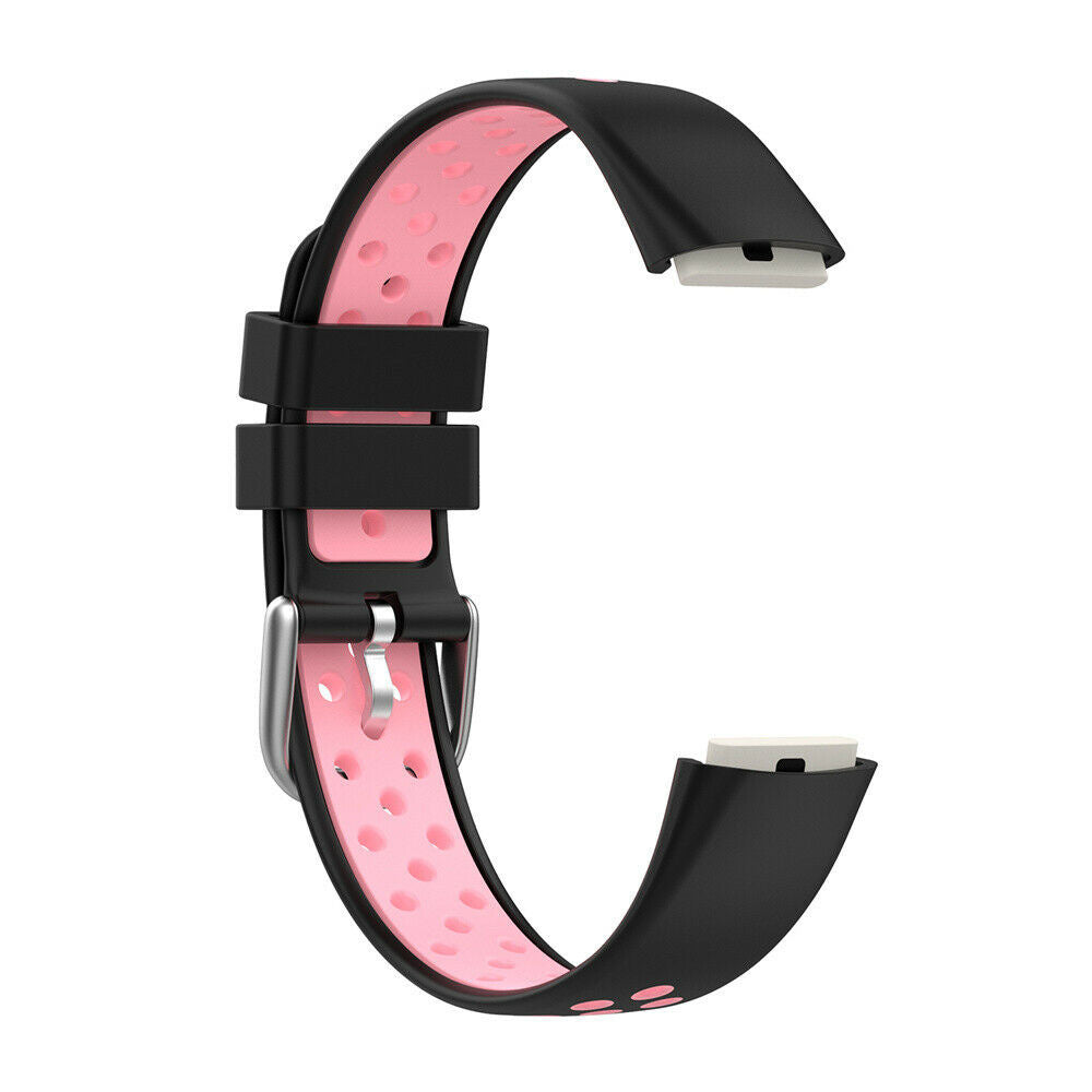 Schwarzes und pinkfarbenes Smartwatch-Armband. Schwarze Außenschicht mit pinkfarbenem Innenraum mit kreisförmigen Löchern. Silberne Schnalle und weiße Anschlussenden.