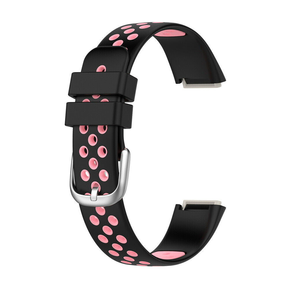 Schwarzes Uhrenarmband mit rosa Punkten und einer silbernen Schnalle. Zwei schwarze Schlaufen und ein rosa Innenraum sind sichtbar.