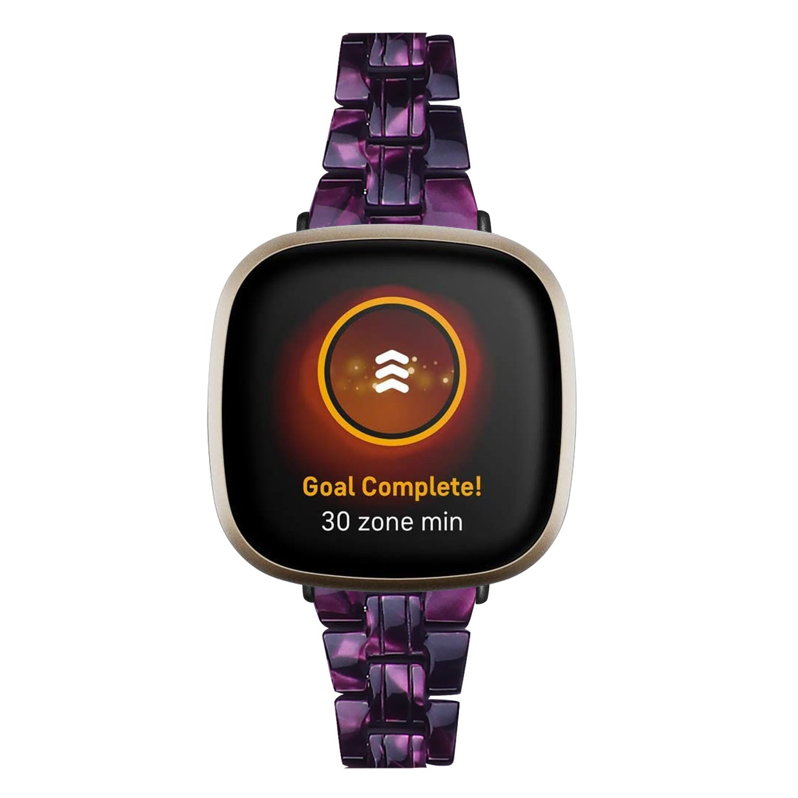 Eine Smartwatch zeigt 'Ziel erreicht!' auf dem Bildschirm an. Die Uhr hat ein lila-schwarzes Armband. Weißer Hintergrund.