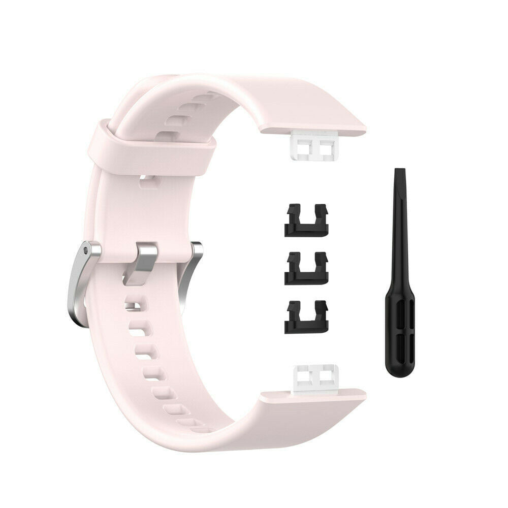 Ein hellrosa Uhrenarmband mit schwarzen Stiften und einem Werkzeug. Das Armband ist gebogen. Der Hintergrund ist weiß.