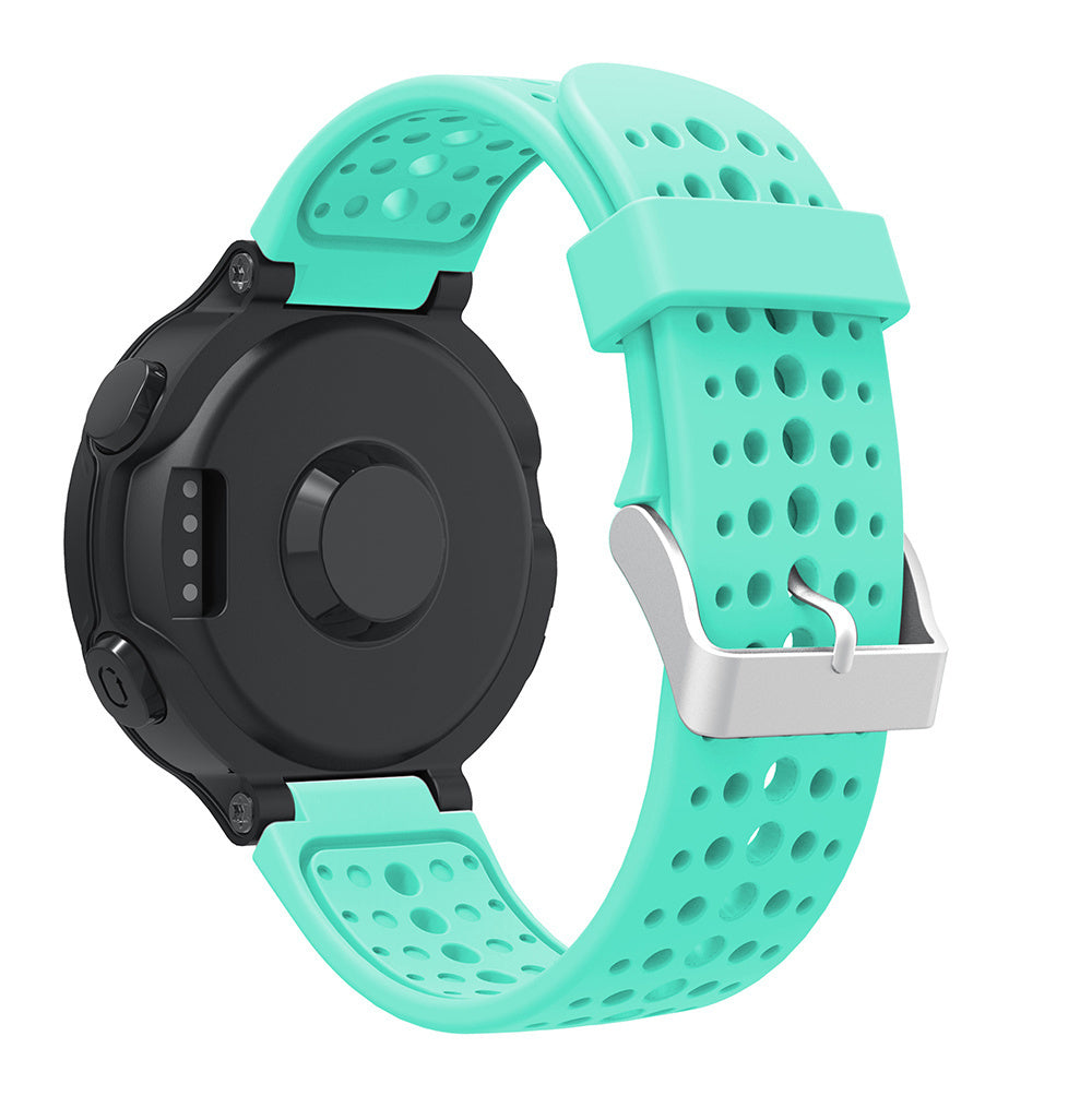 Eine schwarze Smartwatch mit türkisfarbenem Armband wird angezeigt. Das Armband hat Löcher und eine silberne Schnalle. Die Uhr befindet sich auf weißem Hintergrund.
