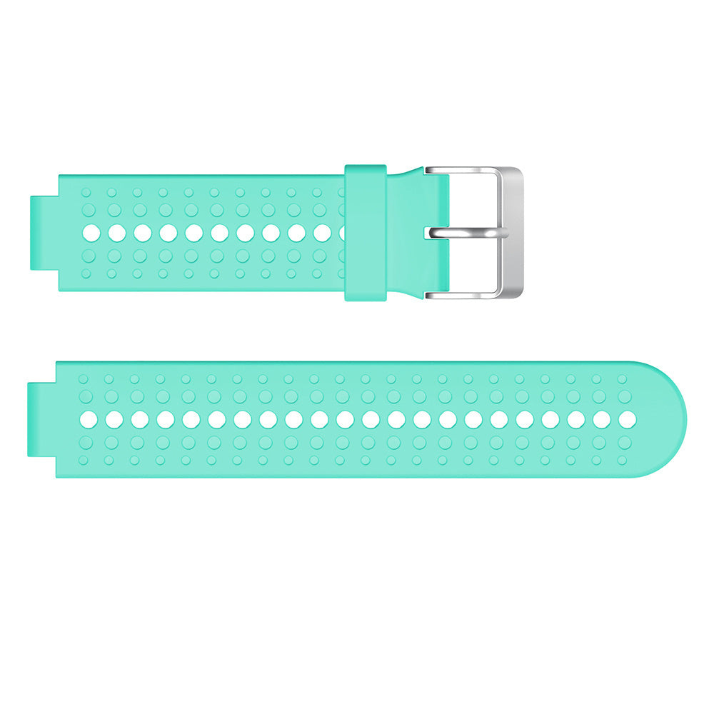 Zweiteiliges türkisfarbenes Uhrenarmband. Das Oberteil hat eine silberne Schnalle. Beide Teile haben mehrere kreisförmige Löcher.