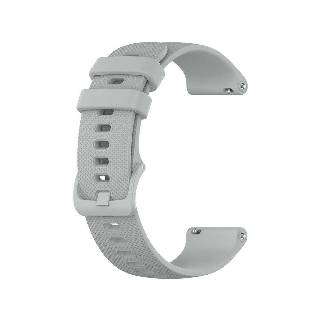 Ein hellgraues Uhrenarmband in 'C'-Form liegt vor weißem Hintergrund. Es hat Löcher zur Anpassung und einen sicheren Verschluss.