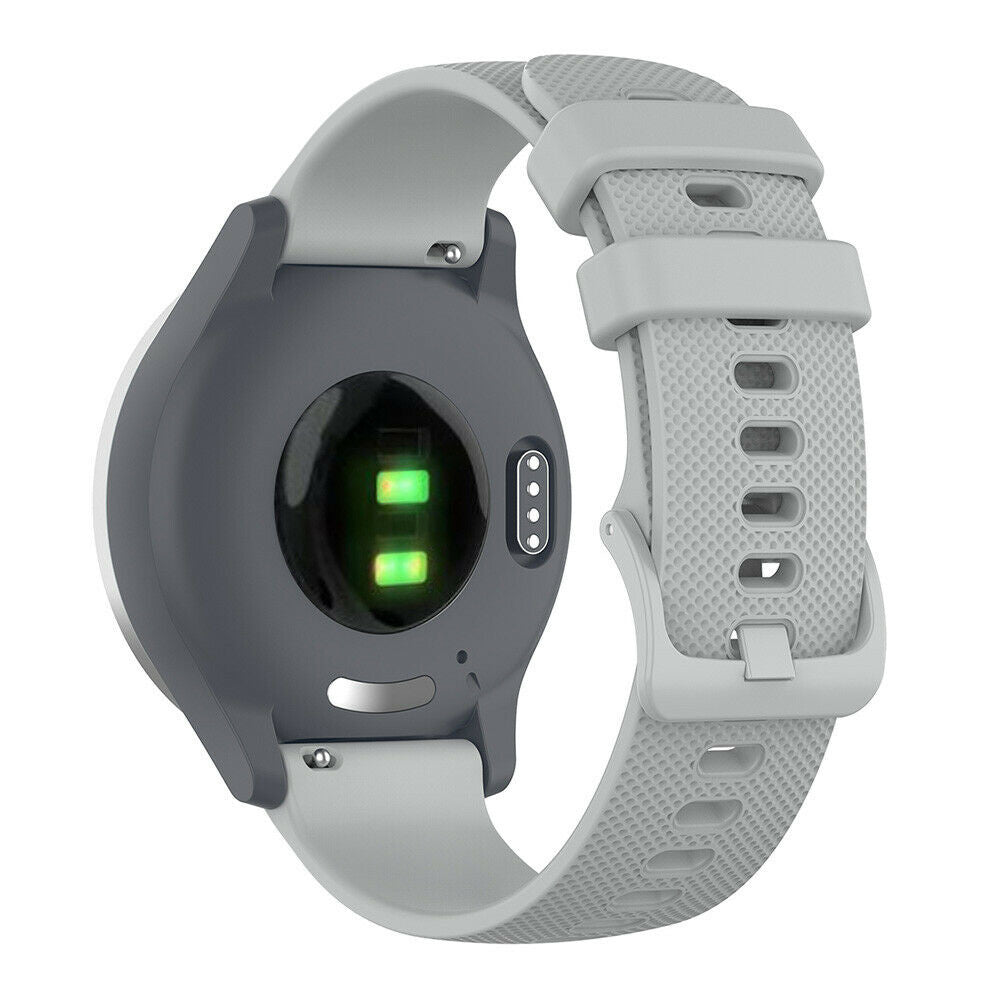 Rückseite einer grauen Smartwatch mit hellgrauem Armband. Die Uhr hat eine dunkelgraue Rückseite mit grünen Lichtern.