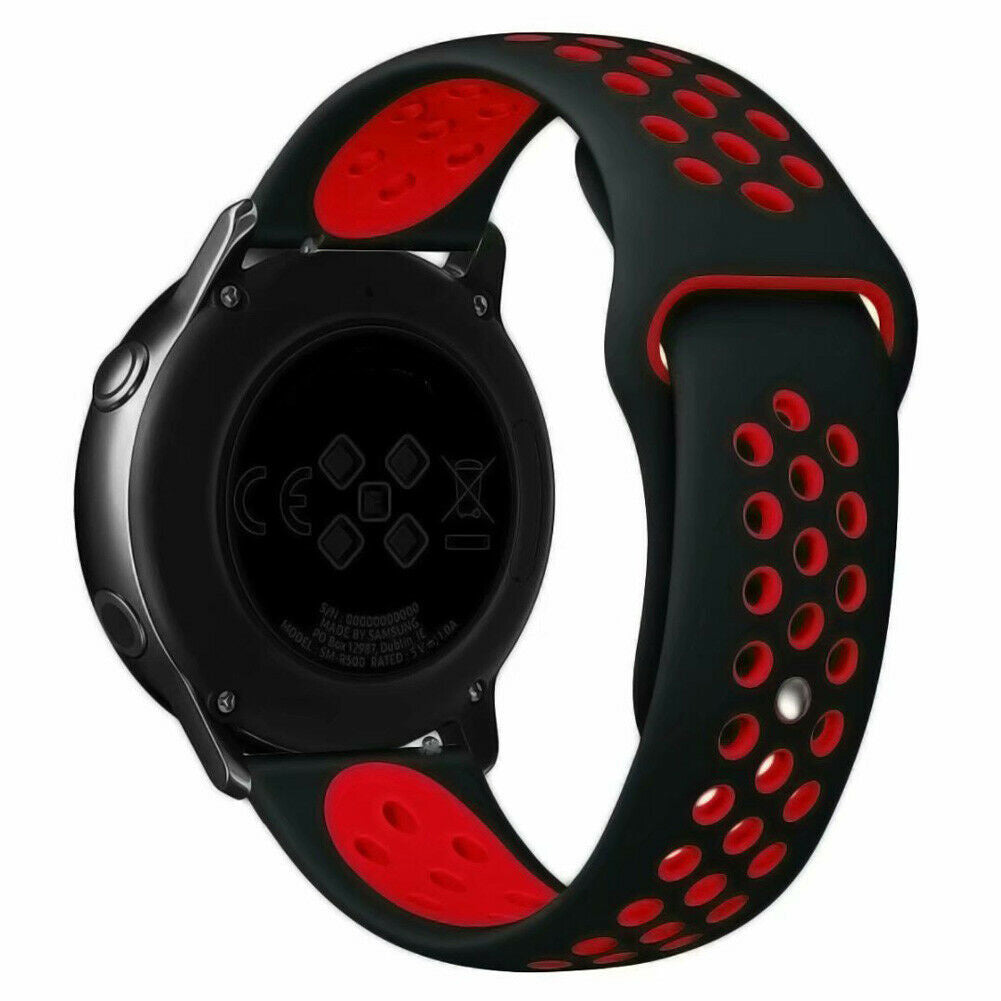 Eine schwarze Smartwatch mit einem rot-schwarzen Armband. Die Rückseite der Uhr zeigt die Seriennummer und weitere technische Details.