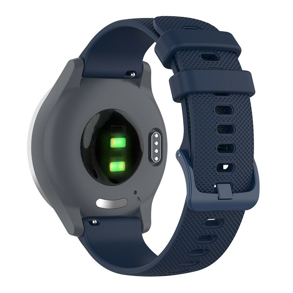 Eine Smartwatch mit blauem Armband. Das Zifferblatt ist grau. Auf der Rückseite sind zwei grüne Lichter und ein Sensor sichtbar.