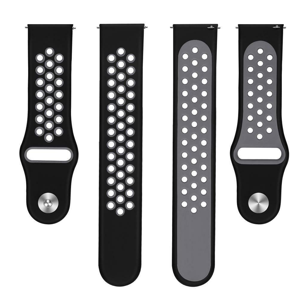 Vier schwarze und graue Armbänder. Zwei sind schwarz mit weißen Punkten, zwei grau mit weißen Punkten. Alle haben Löcher.