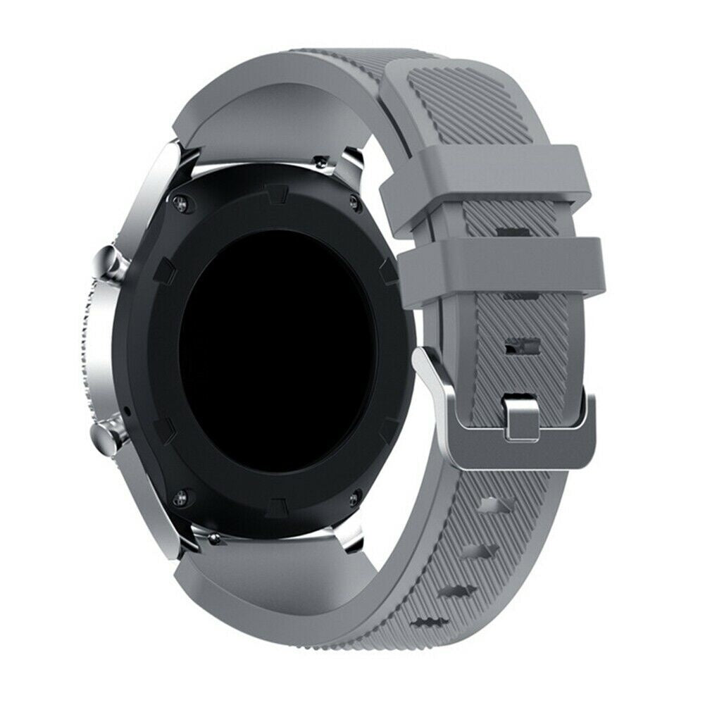 Eine graue Smartwatch wird angezeigt. Sie hat einen runden schwarzen Bildschirm und ein graues Armband mit silberner Schnalle.