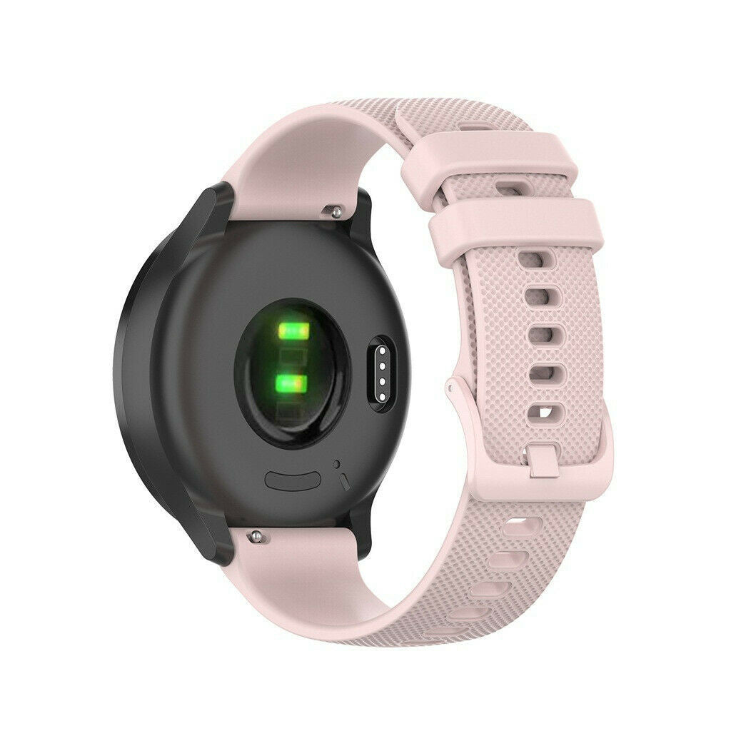 Eine schwarze Smartwatch mit hellrosa Armband. Die Unterseite zeigt grüne Lichter und Sensoren. Das Armband ist geschnallt und hat Löcher.