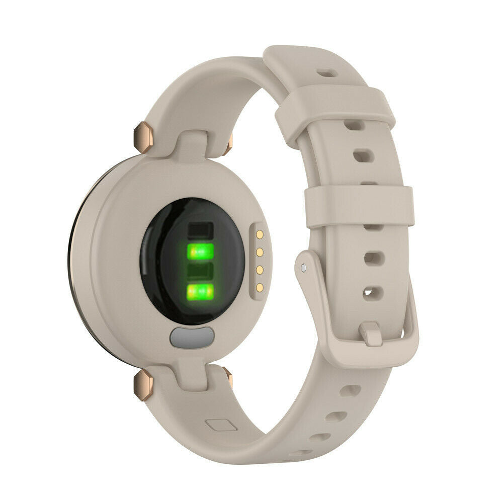 Rückseite einer beigen Smartwatch mit Armband. Es zeigt Sensoren und Lichter. Das Armband hat Löcher und eine Schnalle.