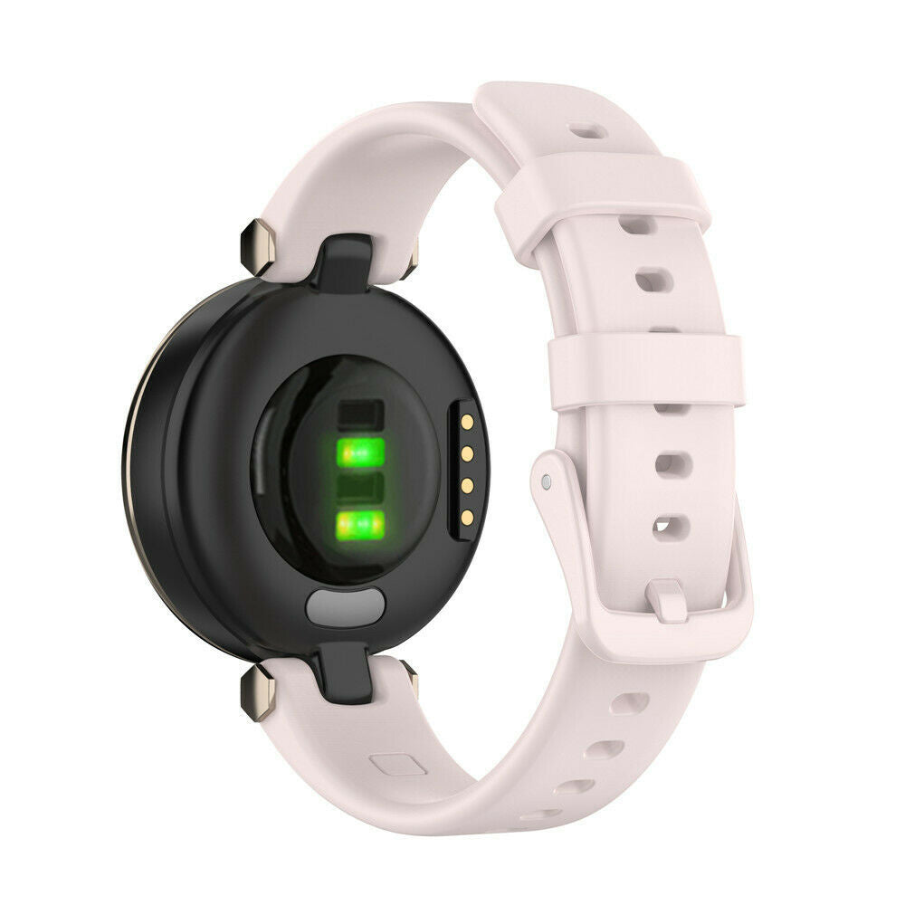 Nahaufnahme einer Smartwatch. Die Uhr ist schwarz mit einem hellrosa Armband. Die Rückseite zeigt Sensoren mit grünen Lichtern.