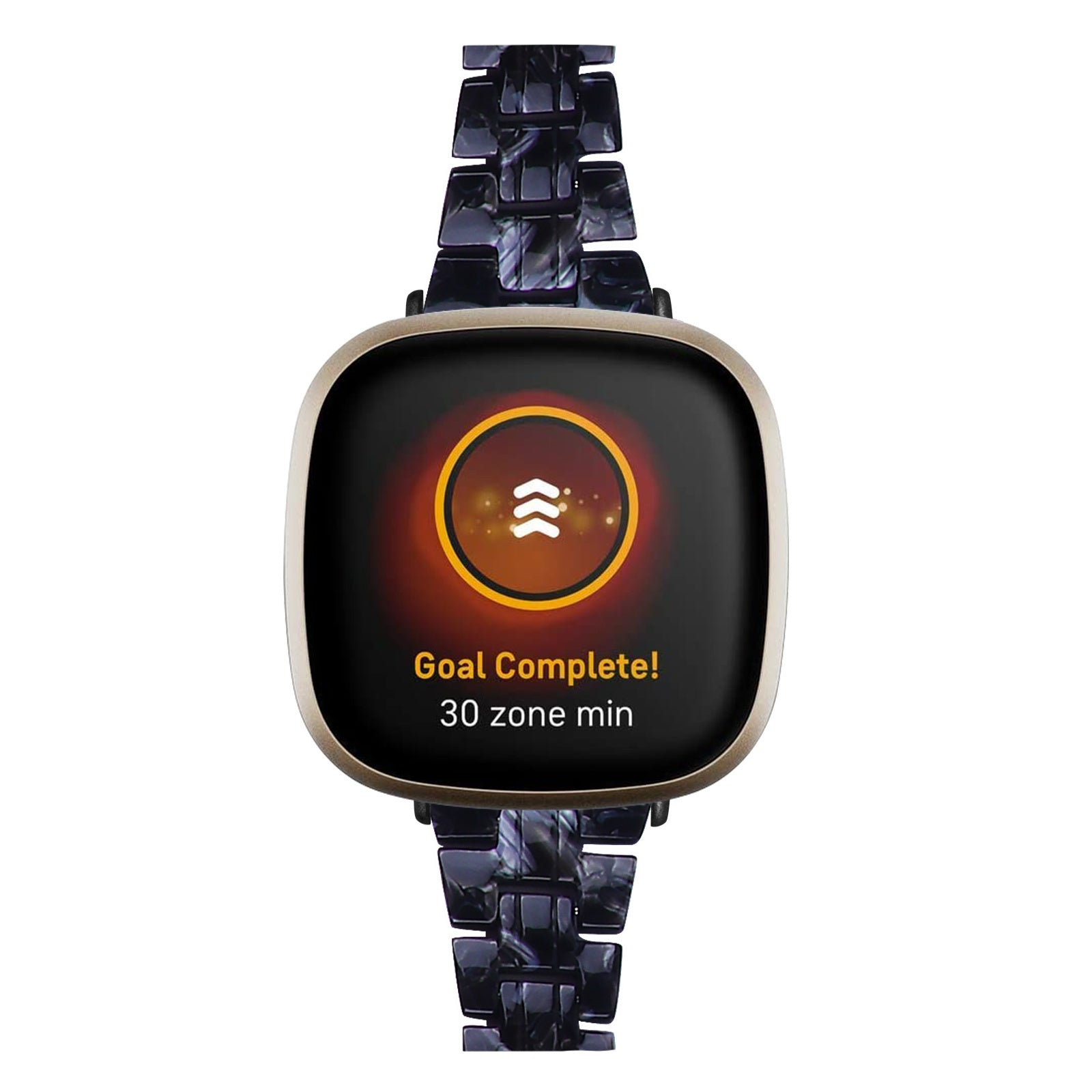 Eine Smartwatch zeigt eine Zielerreichungsnachricht an. Die Uhr hat ein schwarzes Zifferblatt mit goldenem Rand und ein dunkles Armband.