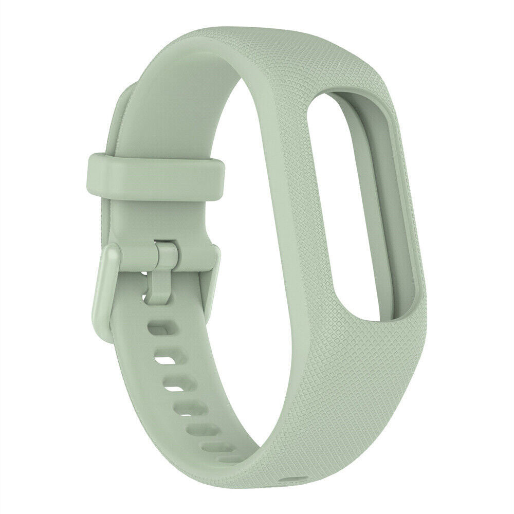 Ein hellgrünes Uhrenarmband wird gezeigt. Es ist ein Einzelstück mit Verschluss und mehreren Verstelllöchern.
