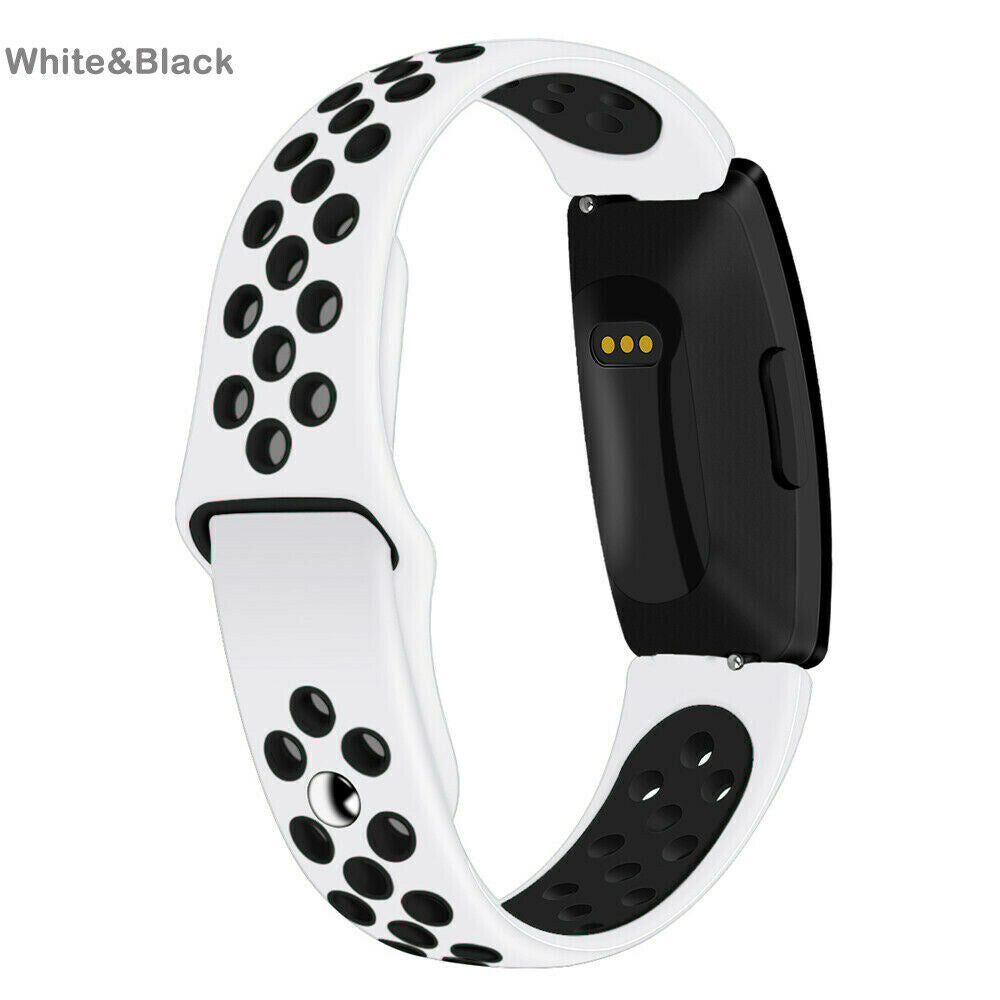 Weißes und schwarzes Smartwatch-Armband. Das Band ist weiß mit schwarzen kreisförmigen Perforationen. Das Zifferblatt ist schwarz.
