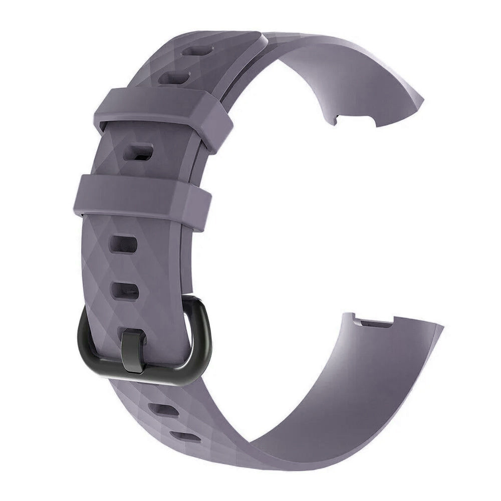 Ein graues Smartwatch-Armband mit schwarzer Schnalle. Das Armband ist mit Rautenmustern strukturiert. Der Hintergrund ist weiß.
