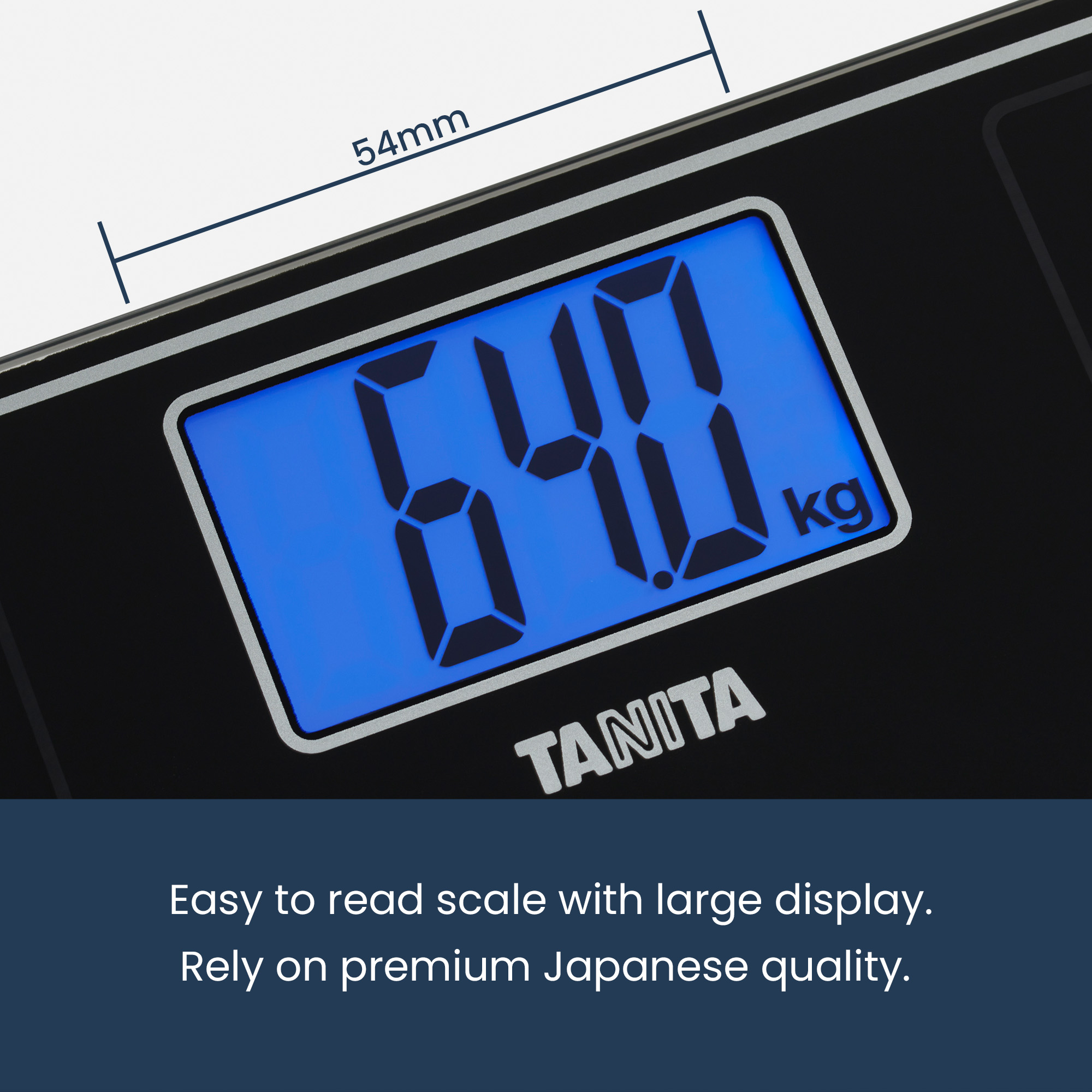 A digital scale displays 64.0 kg. The screen is blue. The scale is black, with the brand name TANITA visible.